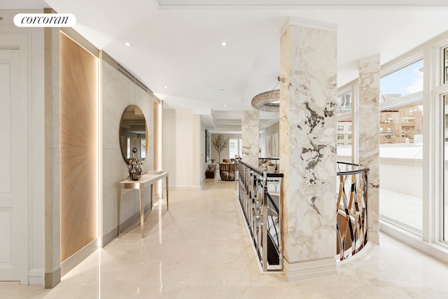 hallway with marble finish floor, visible vents, and recessed lighting