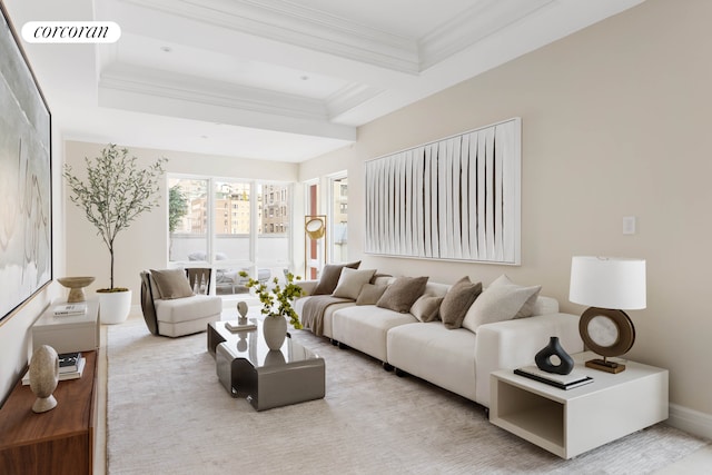 living area with ornamental molding, visible vents, and baseboards