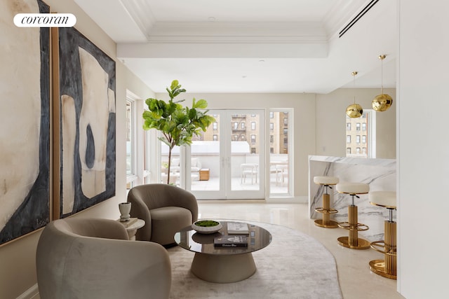 interior space featuring visible vents, ornamental molding, a raised ceiling, and french doors