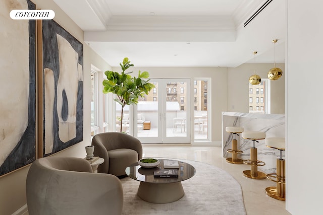 sitting room featuring a wealth of natural light, ornamental molding, visible vents, a raised ceiling, and french doors