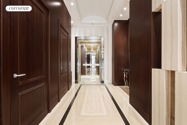 hallway with baseboards and recessed lighting