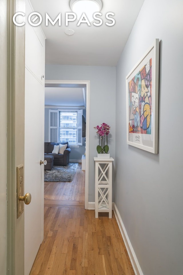 155 E 49th St Unit 10E, New York City, NY 10017 - hallway with light wood-style flooring and baseboards