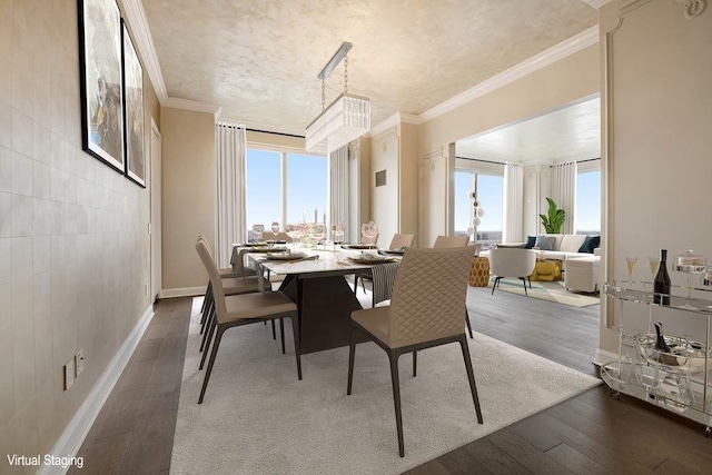 dining area featuring crown molding and hardwood / wood-style flooring