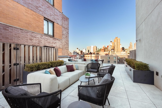 view of patio / terrace featuring a city view and an outdoor living space