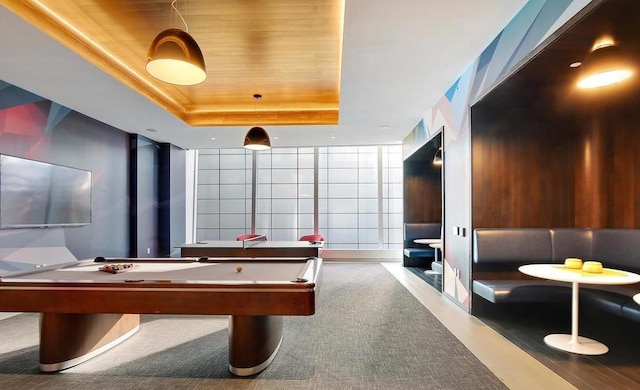 game room featuring a tray ceiling, billiards, and wood ceiling