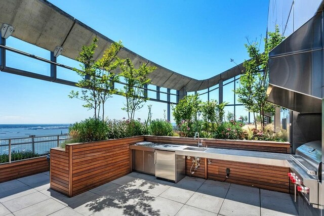 view of patio / terrace featuring grilling area and a sink