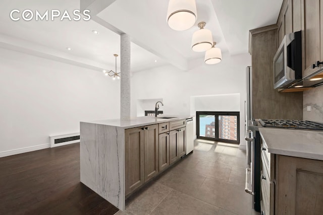 kitchen with stainless steel appliances, a sink, visible vents, beam ceiling, and tasteful backsplash