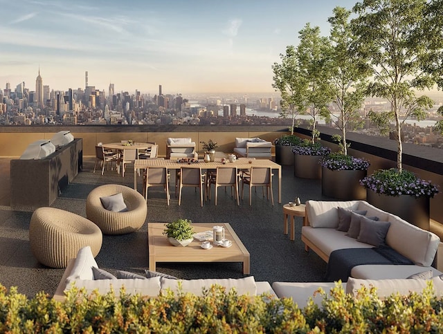 patio terrace at dusk featuring outdoor dining space, a city view, outdoor lounge area, and area for grilling