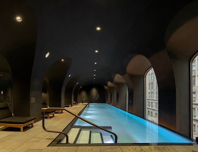 community pool with arched walkways