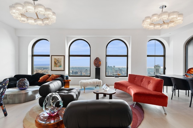 living area featuring a city view, a notable chandelier, and wood finished floors