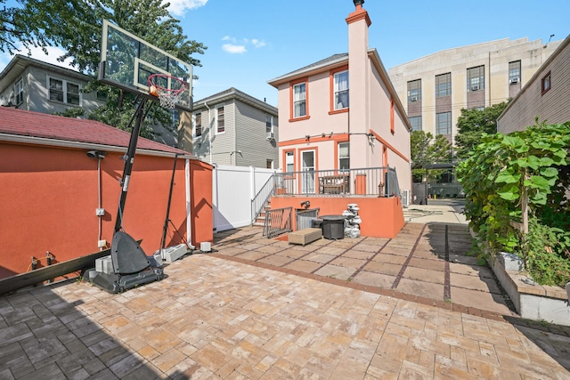 view of patio / terrace with fence and an outdoor structure