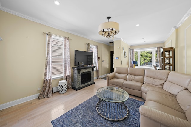 living area with light wood finished floors, ornamental molding, and baseboards