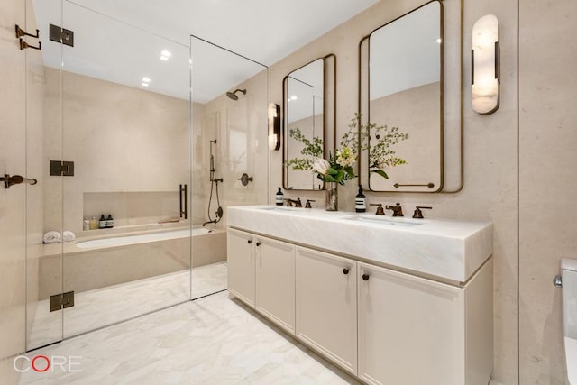 full bathroom featuring toilet, vanity, and shower with separate bathtub