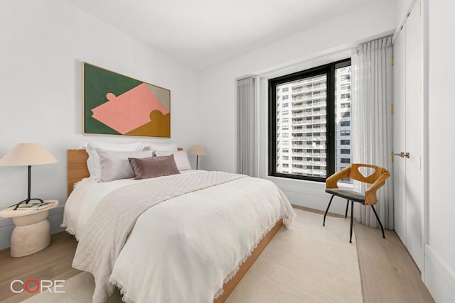 bedroom with light hardwood / wood-style floors