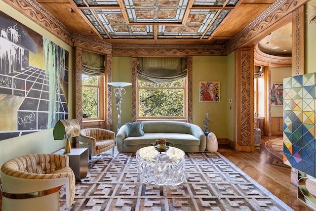 living area with crown molding and hardwood / wood-style floors