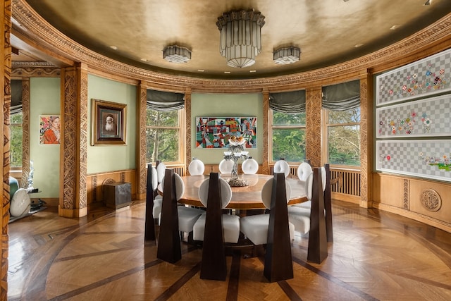 dining area featuring parquet floors and ornamental molding