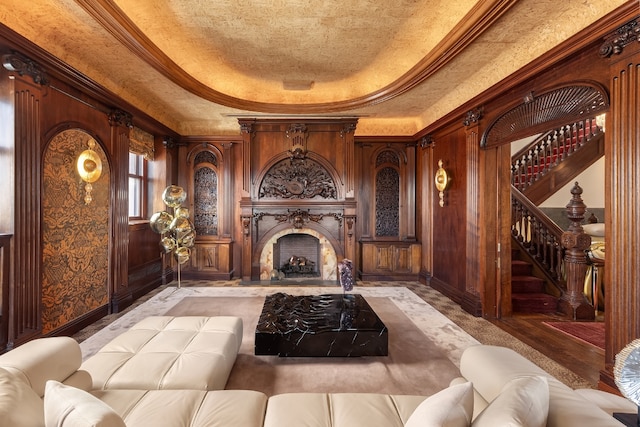 home theater room featuring ornamental molding and a raised ceiling