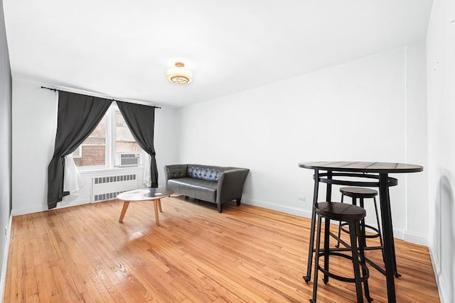 sitting room with radiator and light hardwood / wood-style floors