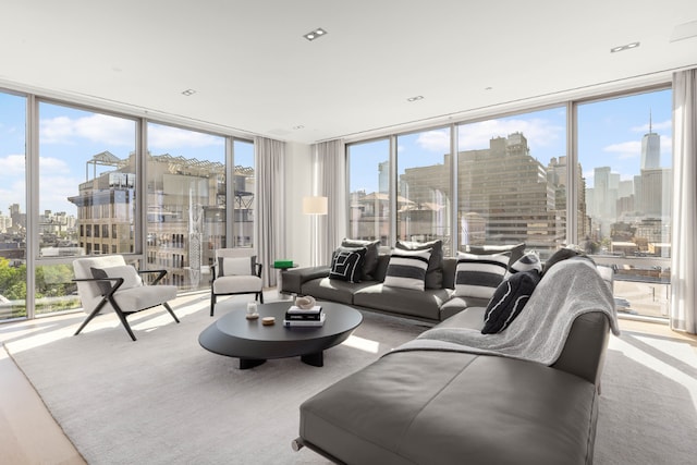 living room featuring floor to ceiling windows and a city view