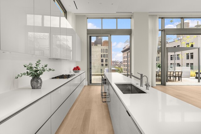 kitchen with light countertops, white cabinets, and modern cabinets