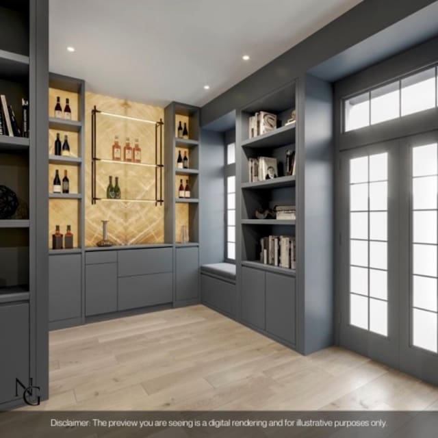 interior space with french doors, light wood finished floors, recessed lighting, and wet bar