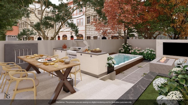 view of patio / terrace with an outdoor fire pit, an outdoor kitchen, and fence