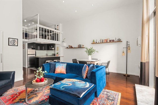 living room with dark hardwood / wood-style floors