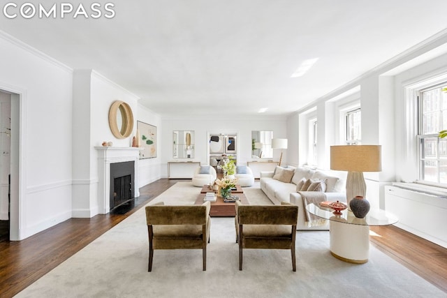 living room featuring ornamental molding and hardwood / wood-style flooring