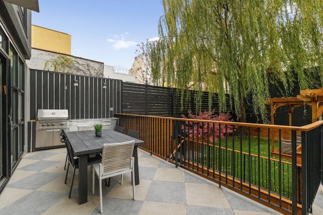 balcony with a patio area, area for grilling, and outdoor dining space