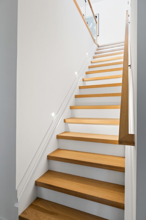 staircase featuring wood finished floors