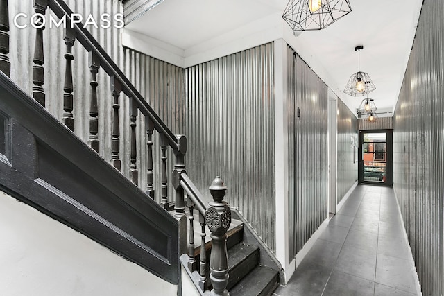 stairway with tile patterned flooring