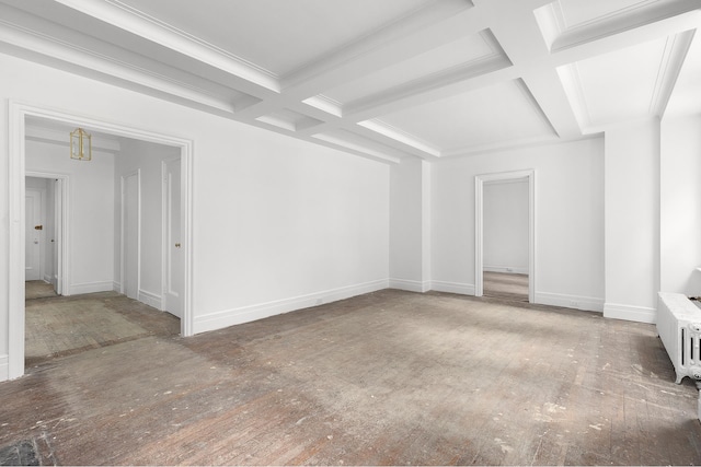 empty room with radiator, ornamental molding, coffered ceiling, beamed ceiling, and baseboards