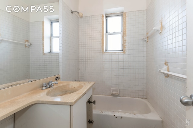 full bathroom featuring tub / shower combination and vanity