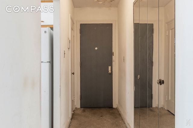 hallway featuring concrete flooring