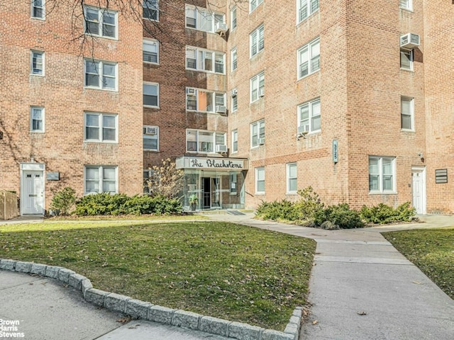 view of property featuring an AC wall unit