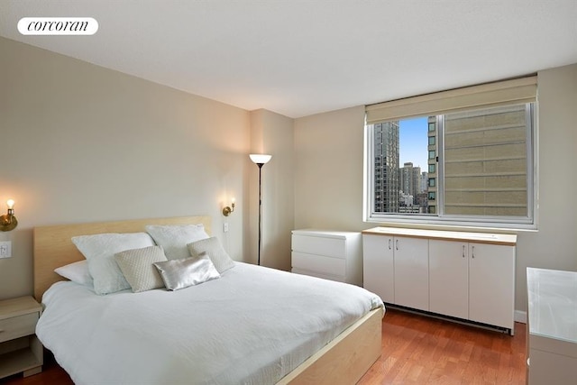 bedroom with light hardwood / wood-style flooring