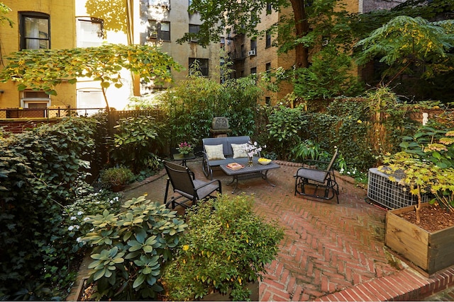 view of patio / terrace featuring fence and an outdoor living space