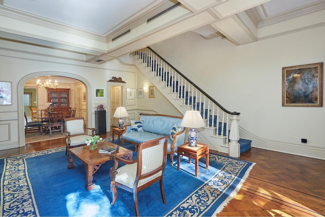 living room with an inviting chandelier, stairs, arched walkways, and ornamental molding