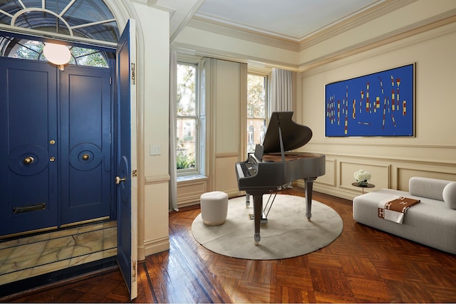 interior space featuring a wealth of natural light, a decorative wall, and crown molding