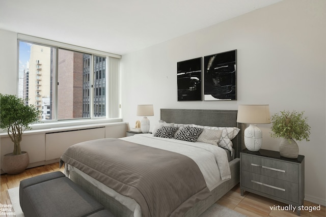 bedroom with light wood-style flooring