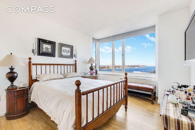 bedroom with light wood finished floors