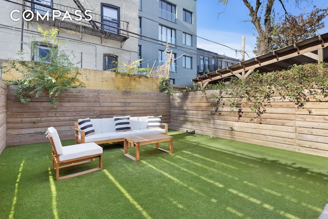 view of yard featuring a fenced backyard and outdoor lounge area