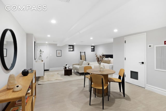 dining room with light wood-style floors, recessed lighting, visible vents, and baseboards