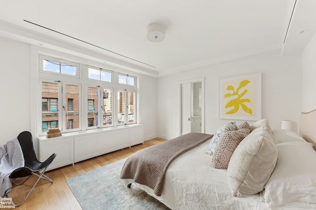 317 W 89th St Unit 9W, New York City, NY 10024 - bedroom featuring light wood-style flooring and a raised ceiling
