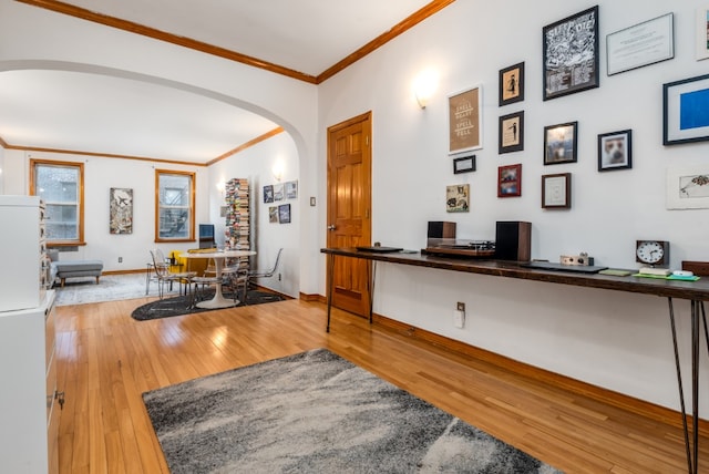 interior space featuring hardwood / wood-style flooring and ornamental molding