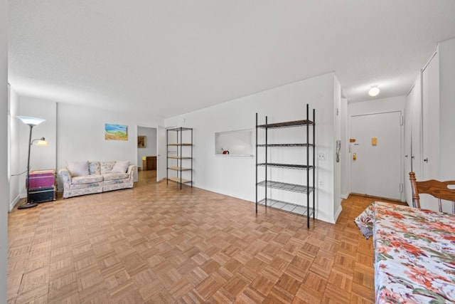 interior space featuring light parquet floors and a textured ceiling