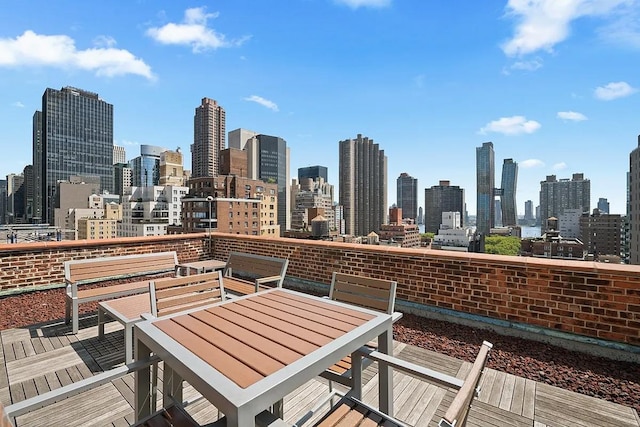 exterior space with a city view and outdoor dining area