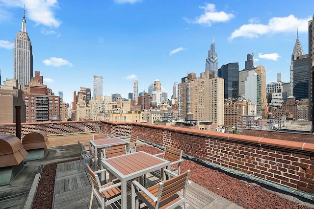 wooden deck featuring a city view