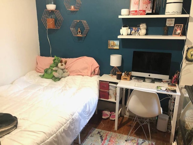 bedroom featuring dark hardwood / wood-style flooring