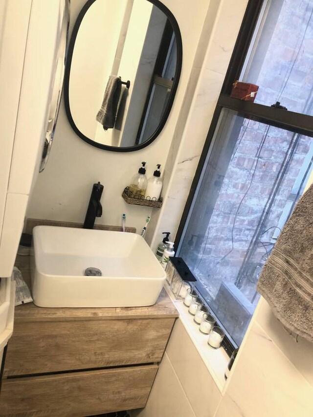 bathroom featuring vanity and wood finished floors